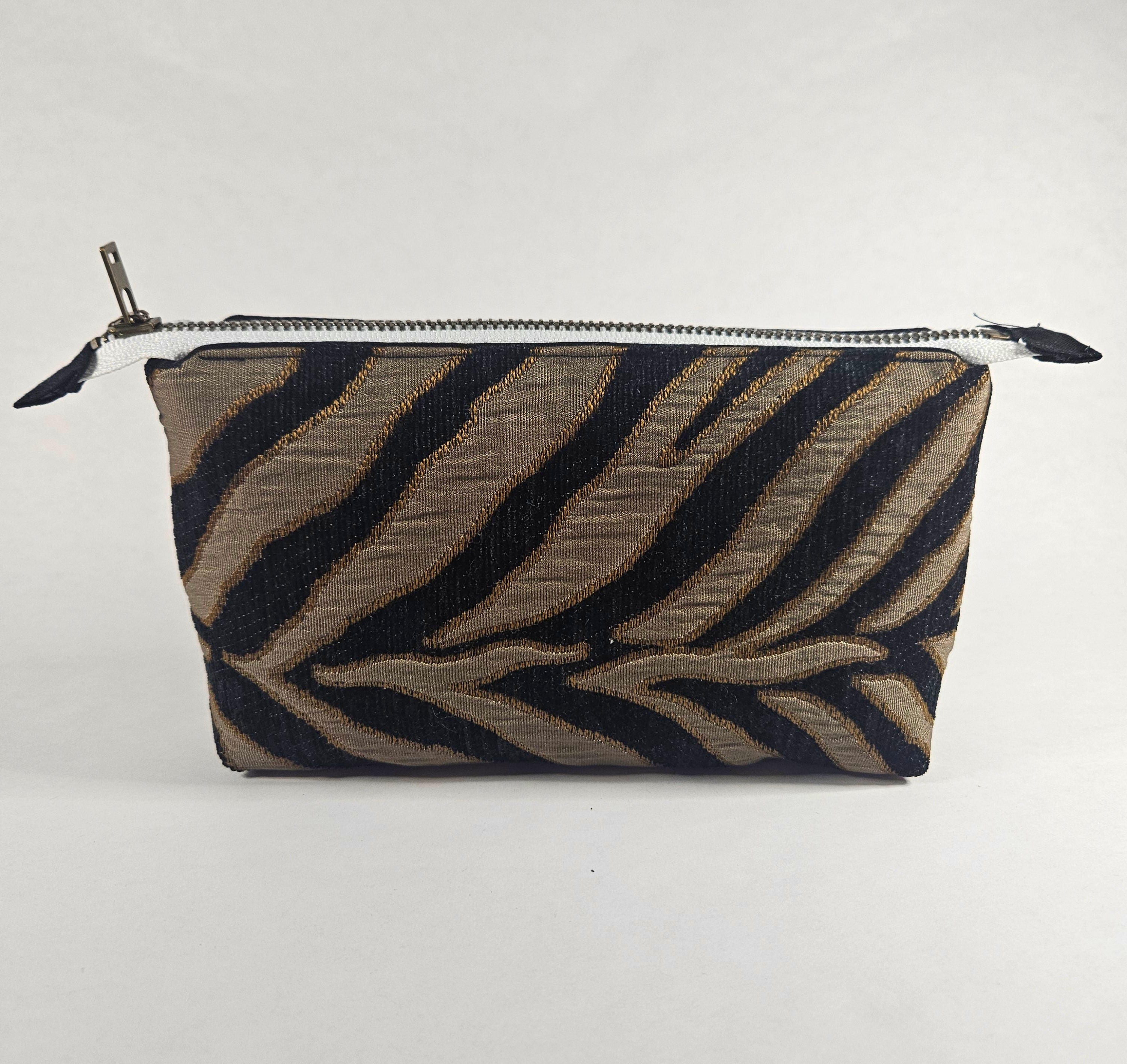 Handmade Up-Cycled, Lined, Zipper Pouch. Black and gold Zebra print