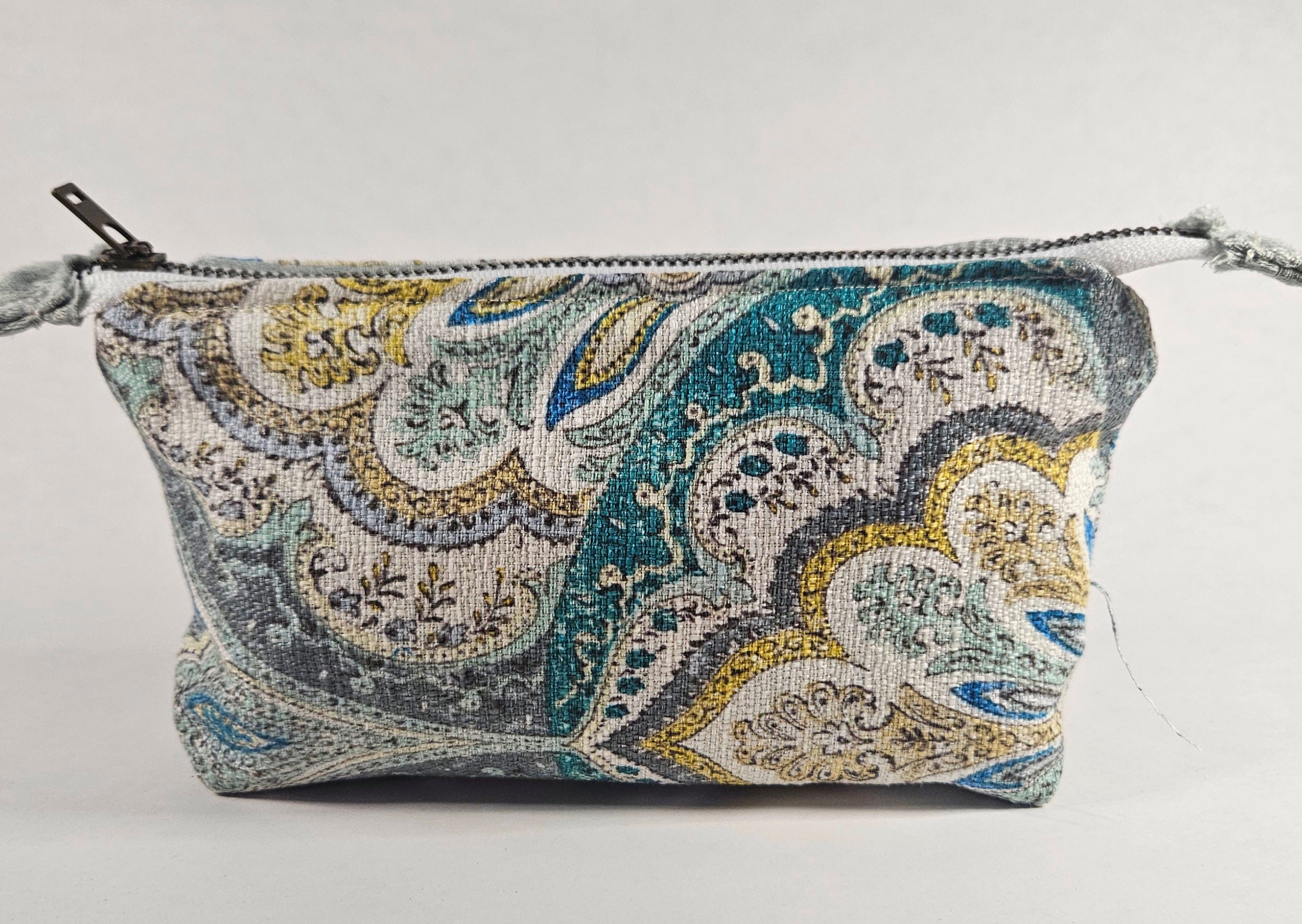 Handmade Up-Cycled, Lined, Zipper Pouch. Light blue Stylized Floral